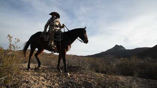 ethan on horse horse in mountains